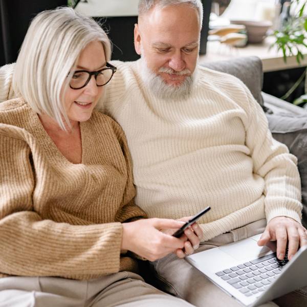 Homeowners looking at laptop